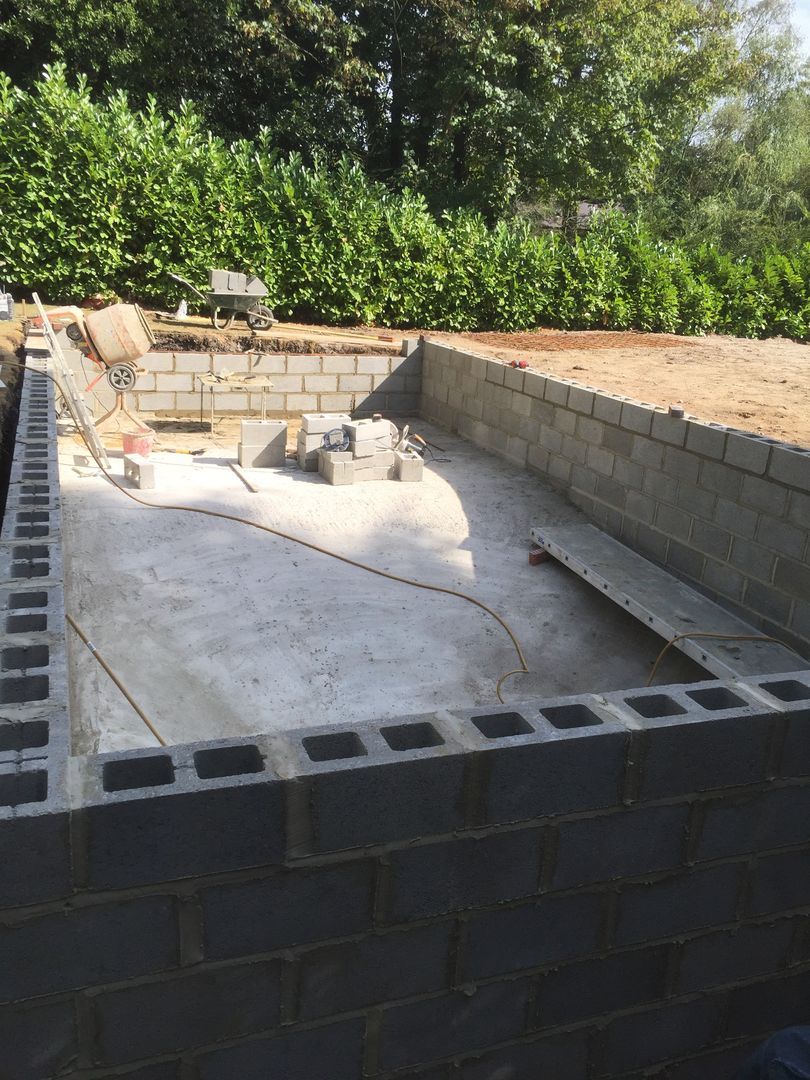 The UK Swimming pools team used concrete blocks to build the sides of the swimming pool