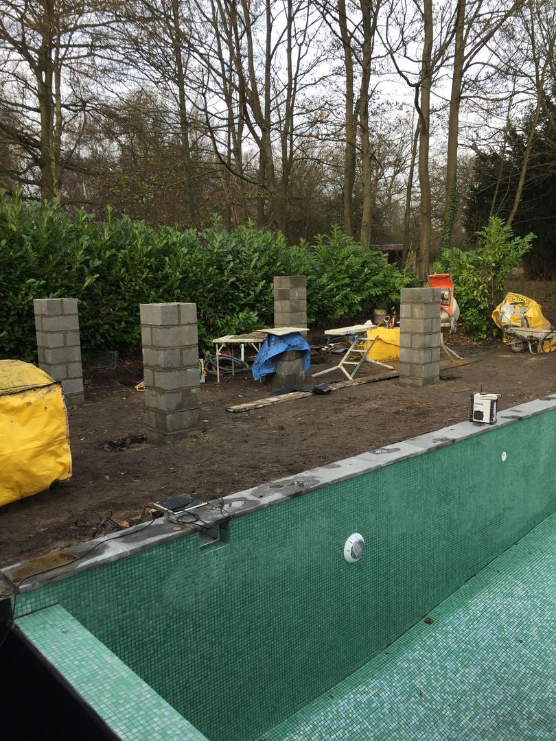 A construction of a new outdoor kitchen area with a slate roof was also requested by the client