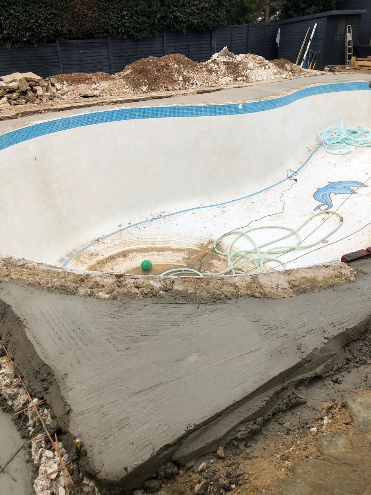 Concrete was applied around the pool for strength and stability Concrete was applied around the pool for strength and stability