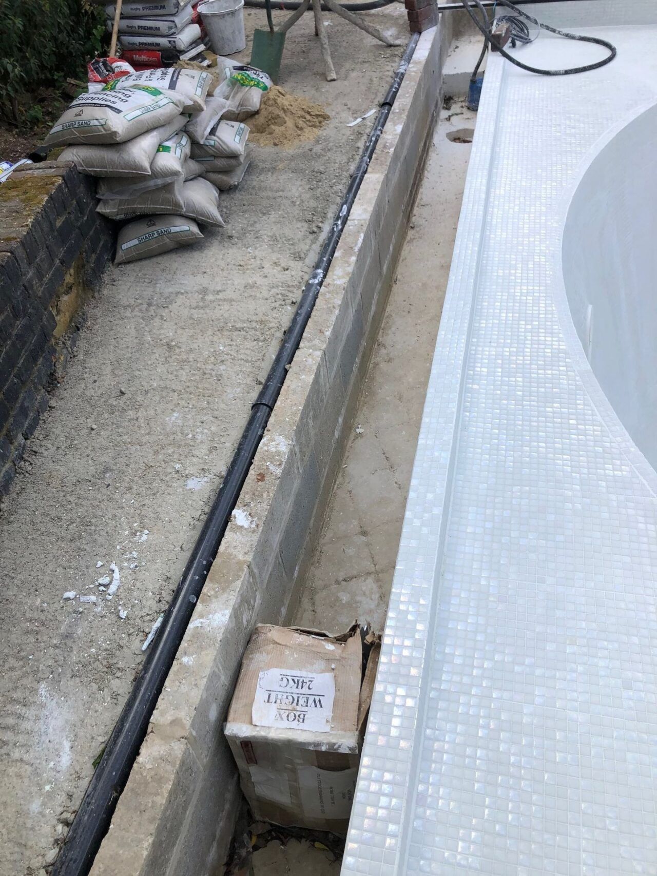 The automated safety pool cover was customized to fit the unique shape The automated safety pool cover was customized to fit the unique shape
