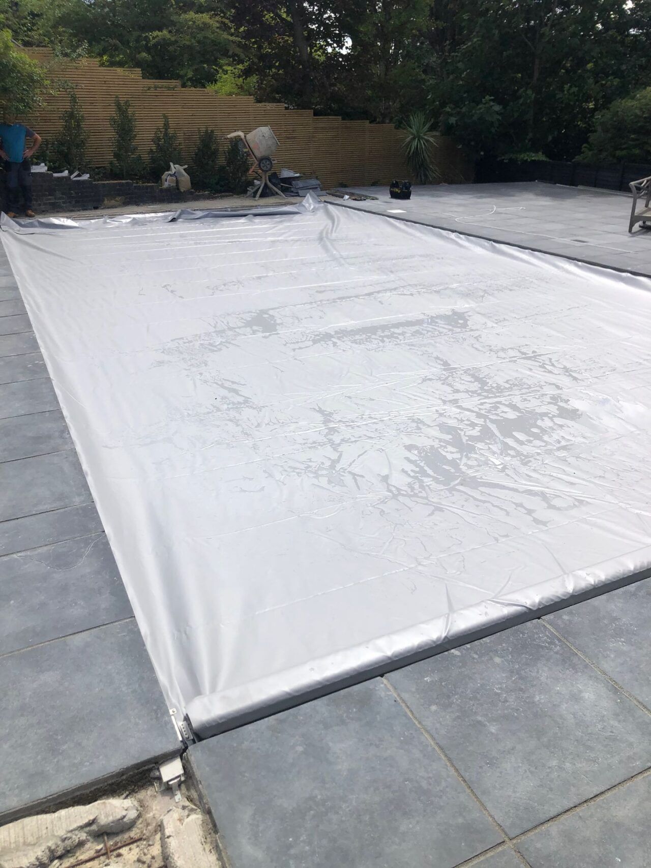 An automated safety pool cover was customized to fit the unique shape An automated safety pool cover was customized to fit the unique shape