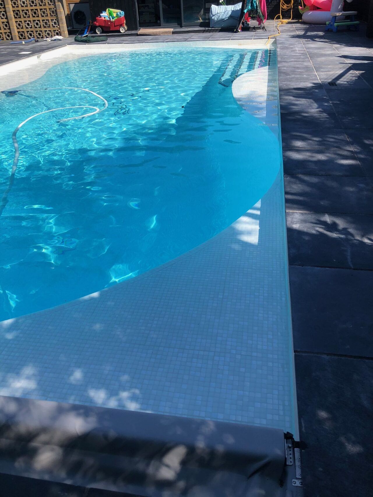 The surrounding pool deck was repaved according to the clients’ vision and The surrounding pool deck was repaved according to the clients’ vision and