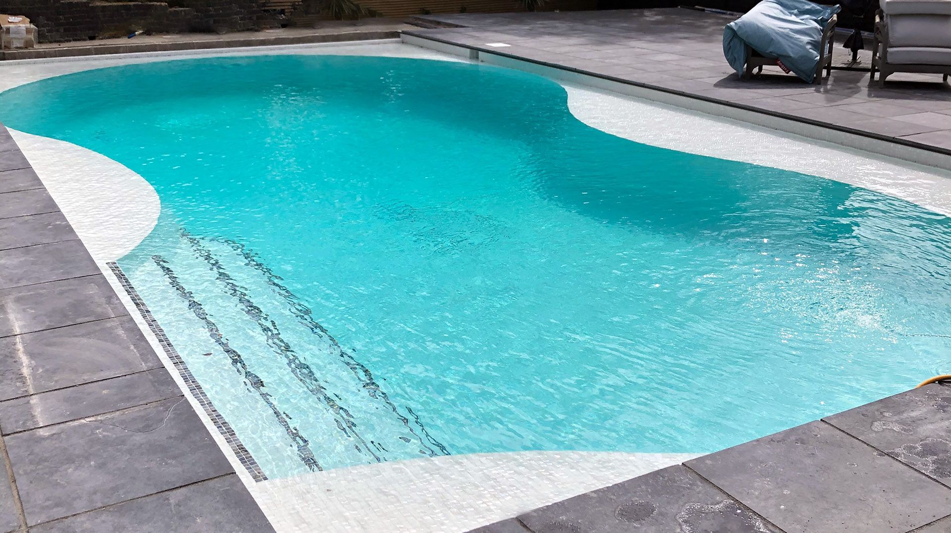 Refurbishing an Irregularly Shaped 1970s Pool with Safety Upgrades