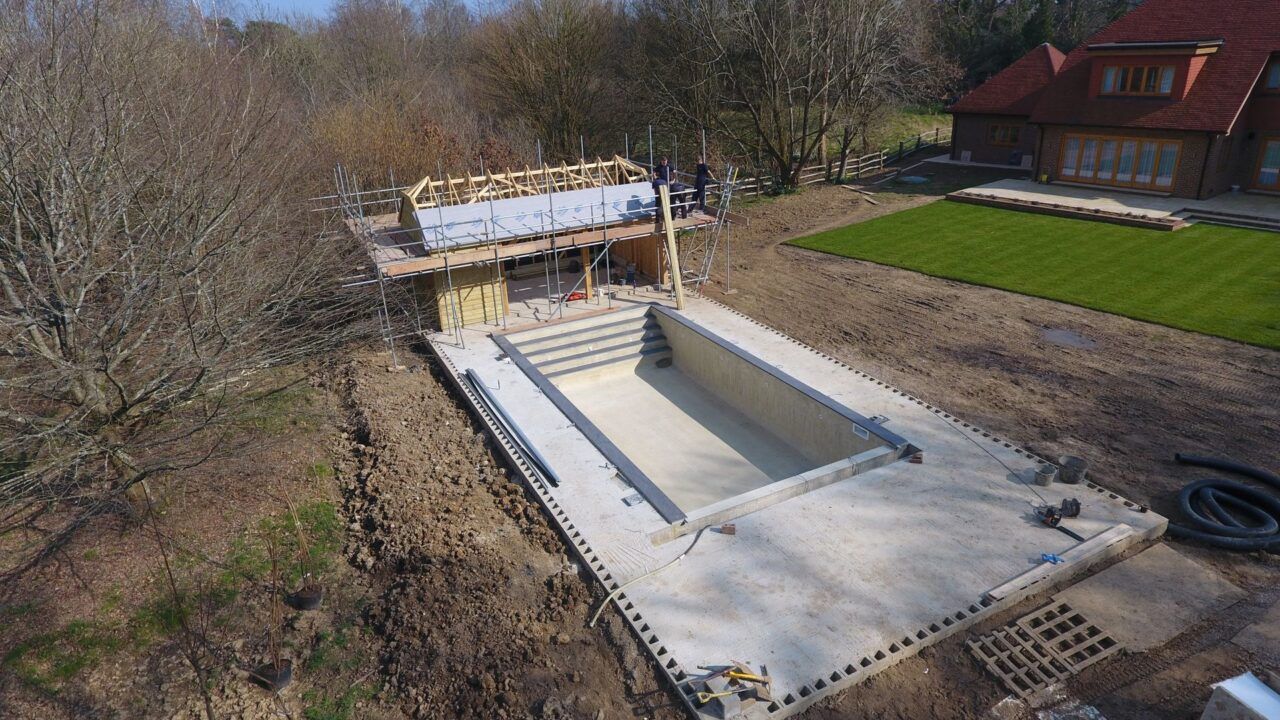 The pool house is being built next to the swimming pool