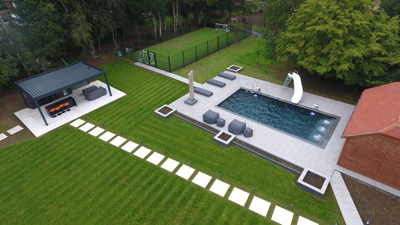 Drone shot of the finished project of this Luxury Swimming Pool by UK Swimming Pools Ltd