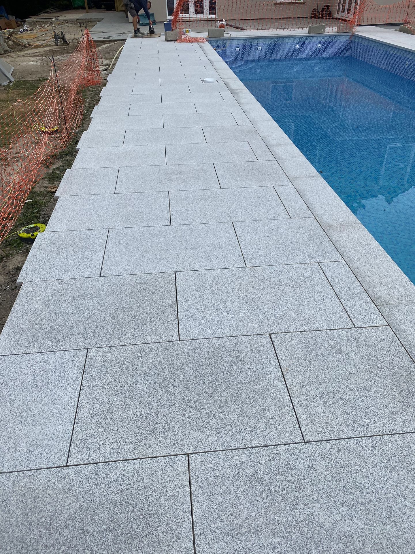 The complex renovation resulted in a completely transformed luxury pool