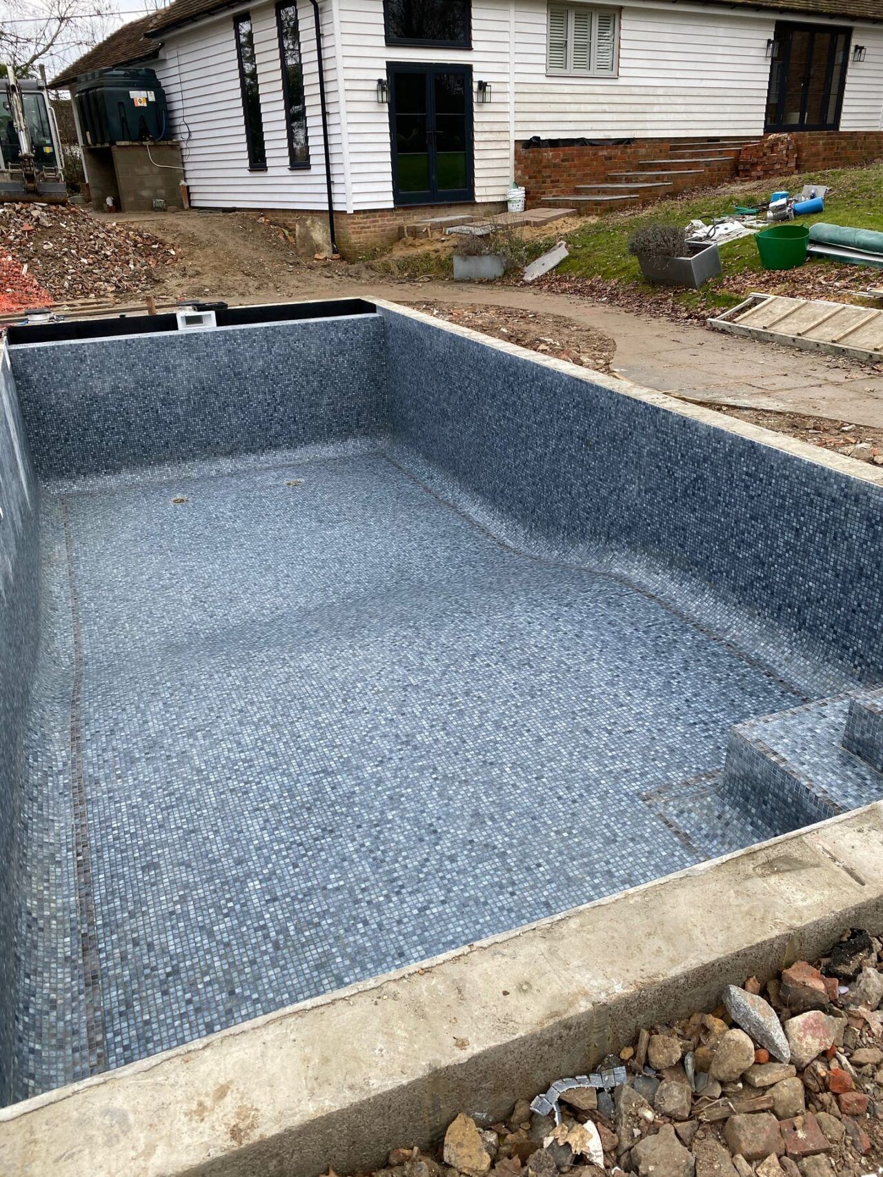 The entire swimming pool has been retiled with a new top-line mosaics by the UK Swimming Pools Team The entire swimming pool has been retiled with a new top-line mosaics by the UK Swimming Pools Team